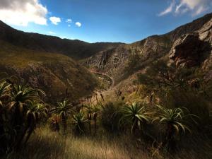 a view of a canyon with palm trees and mountains at Karoo Art Hotel in Barrydale