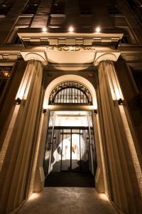 a hallway of a building at night with lights at The Gold Bank in Prague