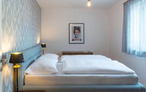 Postel nebo postele na pokoji v ubytování Apartments Traunkai Bad Ischl