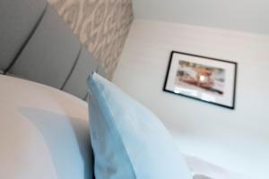 Postel nebo postele na pokoji v ubytování Apartments Traunkai Bad Ischl