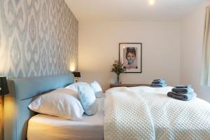 Postel nebo postele na pokoji v ubytování Apartments Traunkai Bad Ischl