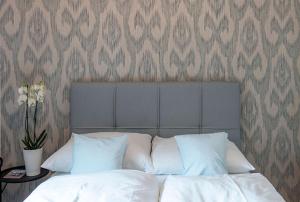 Postel nebo postele na pokoji v ubytování Apartments Traunkai Bad Ischl