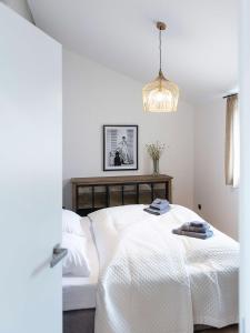 Postel nebo postele na pokoji v ubytování Apartments Traunkai Bad Ischl