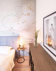 A bed or beds in a room at Apartments Traunkai Bad Ischl