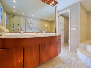 a bathroom with two sinks and a shower at Villa Guacarachas in Cacla D'or +80 photos