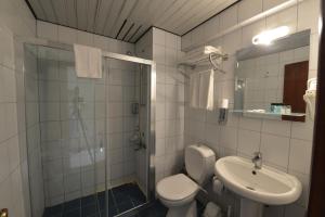 Koupelna v ubytování Kaftans City Hotel by RRH&R