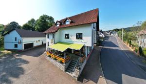 an overhead view of a building on a street at Rennsteighotel Grüner Baum in Schmiedefeld am Rennsteig