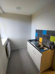 a kitchen with a sink and a counter top at Gite étape la Belle étoile de Flayat in Flayat