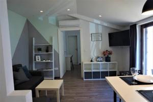 a living room with a couch and a table at Apartment Cosy & Sweet in Makarska