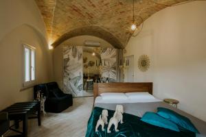 Tempat tidur dalam kamar di Lo Scorcio, casa vacanza nel cuore dei Sassi con vista incantevole con Self check-in