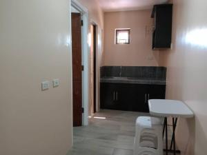 a bathroom with a sink and a counter top at RedDoorz @ JJ & KAYE APARTMENT in Carmen