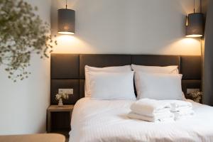 Llit o llits en una habitació de Ap66 Apartments