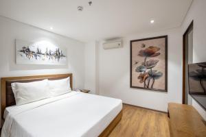 Hai Trieu Hotel客房内的一张或多张床位