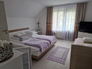 Postel nebo postele na pokoji v ubytování Sobe Ćuskić