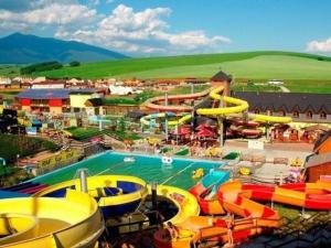 a water park with a pool and a water slide at Holiday house Liptovský Ján in Liptovský Ján