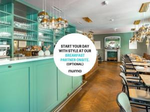 a restaurant with a sign that says start your day with a complimentary breakfast per meal at numa l Mozart in Salzburg