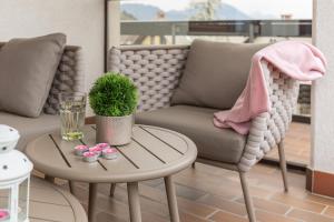 a living room with a couch and a table at Apartment Valy - Relaxing Terrace & Near Bled in Bled