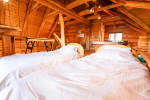 Cama ou camas em um quarto em Lake Toya Hillside House