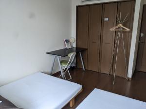 Postel nebo postele na pokoji v ubytování ゲストハウスTSUU小田原 Guest House Tsuu Odawara #OD1