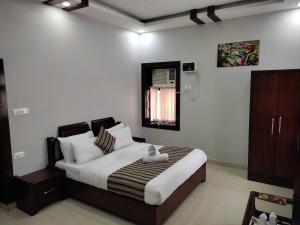 Krevet ili kreveti u jedinici u objektu Hotel Krishna Ji