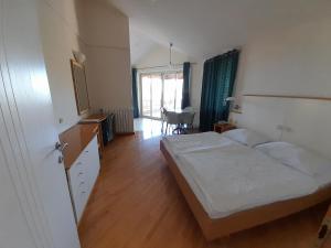 Posteľ alebo postele v izbe v ubytovaní Aparthotel Plat