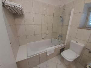Ванна кімната в Aparthotel Plat