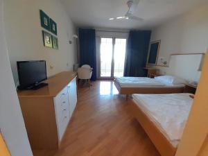 Posteľ alebo postele v izbe v ubytovaní Aparthotel Plat