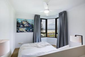 a bedroom with a bed and a window at The Breakers in Gold Coast +37 photos
