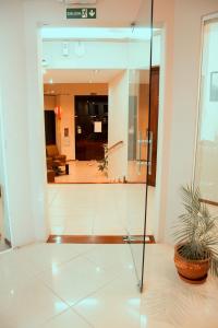 a glass door leading into a living room at Hotel Argon in Dolores