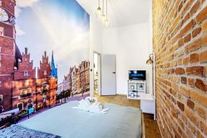 a room with a wall mural of a city at Rynek 3 Old Town in Wrocław