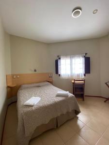 Postel nebo postele na pokoji v ubytování Hotel Argon