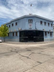 a large blue building on the corner of a street at Hotel Argon in Dolores