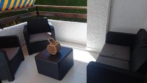Posedenie v ubytovaní Fantástico Apartamento a 50m de playa Colon y Paseo