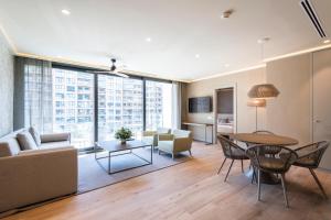 Televízia a/alebo spoločenská miestnosť v ubytovaní Apartamentos Core Suites Valencia