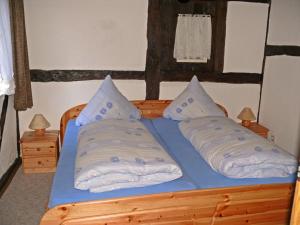A bed or beds in a room at Der Wildungshof