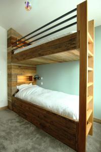 a wooden bunk bed in a room at Tignes 2100, tout confort in Tignes
