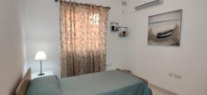 Llit o llits en una habitació de Lorenza Letting Maisonette