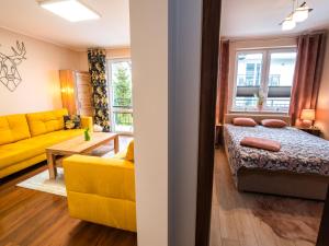 Posteľ alebo postele v izbe v ubytovaní Markowe Apartamenty Złoty Park + 37 fotografií