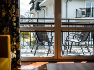 Posedenie v ubytovaní Markowe Apartamenty Złoty Park