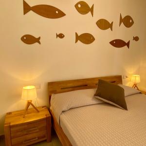 Posteľ alebo postele v izbe v ubytovaní SeaSun Guest House Alghero