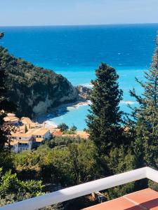 a view of the ocean from the balcony of a house at Myrto Homes Lefkada Agios Nikitas Greece in Agios Nikitas