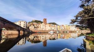 a reflection of a city in a body of water at Casa Sisina in Flussio