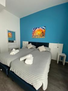 Voodi või voodid majutusasutuse Hotel Aurora & Appartamenti toas