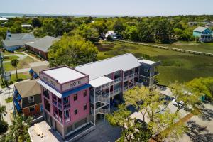 an overhead view of a building with a pink house at Hotel Folly with Marsh and Sunset Views in Folly Beach