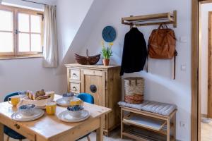 a dining room with a wooden table and a woodenventory at Appartements Adam-Mühle in Spitz