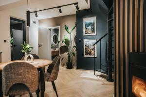 a dining room with a table and chairs at Rezydencja Bieszczady - Solina in Solina