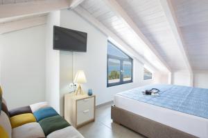 A bed or beds in a room at The Lefkadian collection G and N