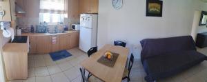 Kuchyň nebo kuchyňský kout v ubytování Holiday & Business Furnished Apartments