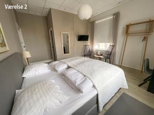 Krevet ili kreveti u jedinici u okviru objekta Hotel Højslev Kro