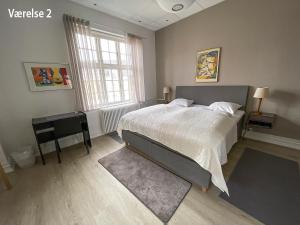 Krevet ili kreveti u jedinici u okviru objekta Hotel Højslev Kro